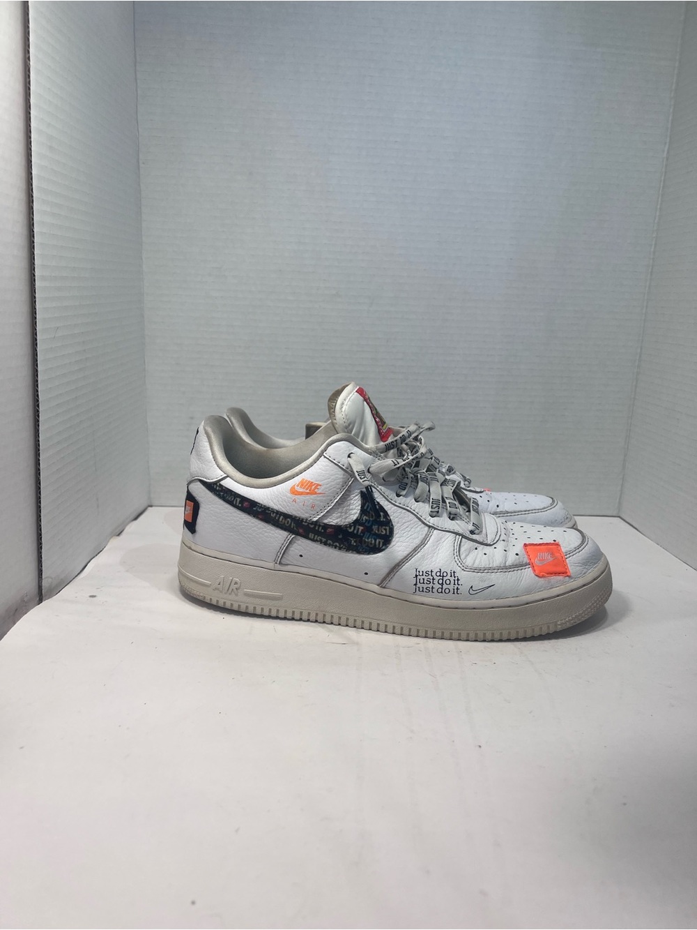 Nike Men’s White Sneakers with Bright Orange Accents